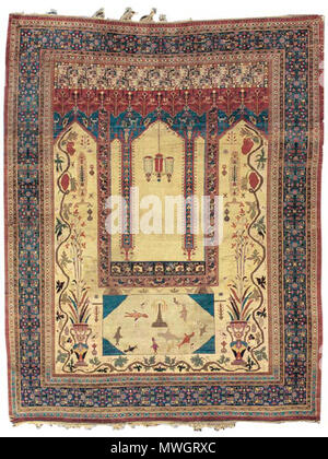 . Una seta preghiera DECCANI RUG . Inglese: "una seta preghiera DECCANI RUG. India centrale, ultimo quarto del XIX secolo o in precedenza. Il campo d'Avorio con una coppia di balaustra marmorea policroma vasi rilascio delicato spray floreali circondato da bold lo scorrimento della vigna, appendere le uve, delicati motivi floreali e stilizzata di un cipresso, avorio losanga rettangolare che racchiude il pesce stilizzato, animali, una fontana centrale e blu pennacchi, tutti al di sotto di una forma rettangolare in stile turco la preghiera del pannello con una coppia di motivi floreali blu colonne che supportano una consegna centrale campana tripla a forma di vaso sopra, in un rosso mattone cornice floreale con un blu Foto Stock