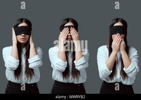 Variazioni della giovane donna in nero con gli occhi bendati di chiudere le orecchie, gli occhi e la bocca isolato su grigio Foto Stock