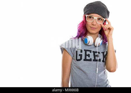 Studio shot di geek girl holding occhiali e pensare con Lui Foto Stock