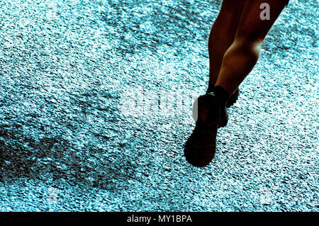 Le gambe di un maratoneta durante una competizione Foto Stock