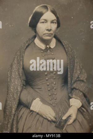 . 'Un daguerreotype Ritratto di signora seduto, tenendo un piccolo album o daguerreotype caso nella sua mano sinistra, indossando un anello di nozze sul suo dito e uno scialle modellato sulle sue spalle, con gennaio 17th, 1852 graffiato lungo la parte inferiore sinistra perimetro dove la piastra incontra il tappetino e nuovamente graffiato lungo angoli inferiori destro e sinistro sotto il tappetino, Cooley Springfield timbro su mat' . 1852. Cooley 7 1852 donna ritratto byCooley Springfield Foto Stock