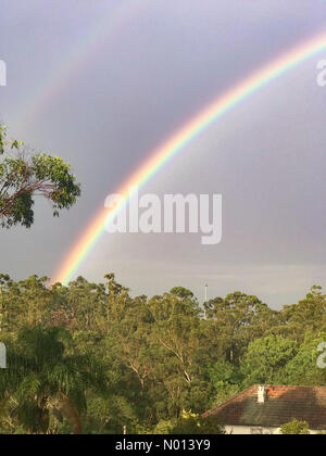 Sydney, New South Wales, Australia. Australian Weather, 18th December 2020: Rainbow seen over the Sydney, New South Wales suburb Killara as rain passes through the area. Credit: mjmediabox/StockimoNews/Alamy Live News Stock Photo