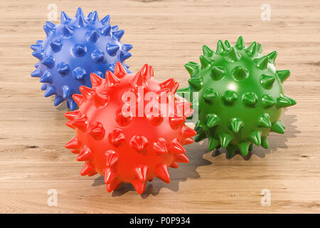 Set di colorate sfere pungenti per massaggio o giocattoli per animali domestici sul tavolo di legno. Il rendering 3D Foto Stock