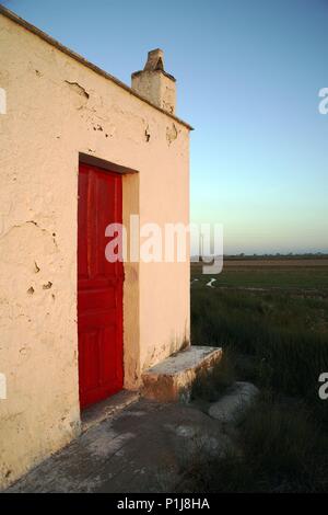 Spagna - Catalogna - Montsià (distretto) - Tarragona. Delta del Ebro; (53) barraca y arrozal al atardecer (.. Foto Stock