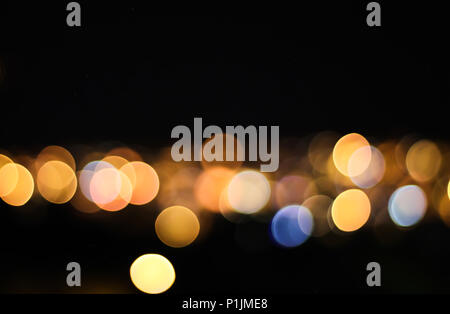 Magnifica bokeh cerchi da notte scape panorama cittadino Foto Stock