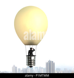 L'uomo prendendo la lampada incandescente palloncino su flottante city building e guardando il luogo distante Foto Stock