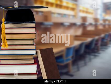 Libri e graduazione hat nella libreria di istruzione Foto Stock