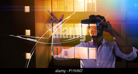 Immagine composita dell'uomo utilizzando una realtà virtuale dispositivo Foto Stock
