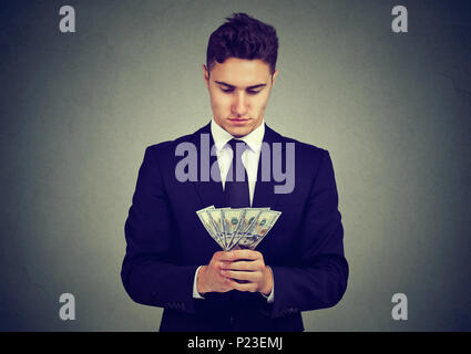 Ambizioso business man con il denaro Foto Stock