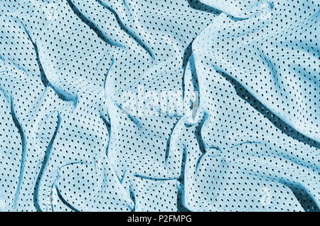 Sport Abbigliamento tessuto di sfondo di texture. Vista superiore della luce blu in nylon poliestere tessuto superficie tessile. Colorata maglietta da basket con spazio libero per t Foto Stock