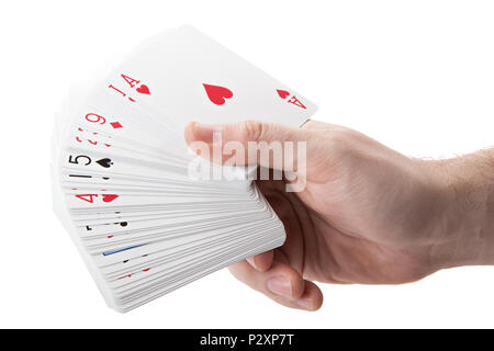 Fan di carte da gioco in mano su uno sfondo bianco isolato Foto Stock
