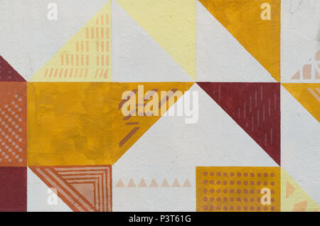 L'arte al muro dipinto di texture. Pattern triangolari, sfondo colorato Foto Stock