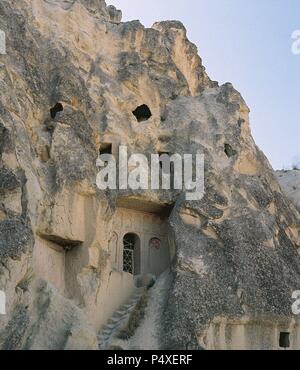 La Turchia. Goreme. Le abitazioni scavate nella roccia. Cappadocia. Foto Stock