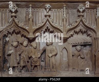 ARTE gotico. ESPAÑA. MONASTERIO DE SAN JUAN DE Ortega. Sepultura DE SAN JUAN DE ORTEGA (siglo XV). Se encuentra en el antiguo convento homónimo, cuya construcción i dati del siglo XII. Detalle escultórico de PEREGRINOS REALIZANDO LA RUTA DEL CAMINO DE SANTIAGO. Provincia de Burgos. Castiglia-león. Foto Stock