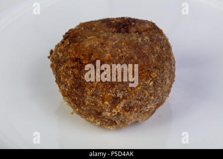 Cotto al forno con le polpette di maiale nella piastra Foto Stock