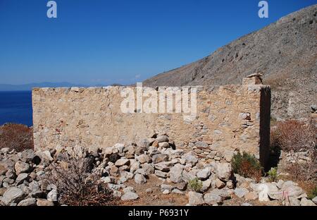 I resti del villaggio abbandonato di Gera sull'isola greca di Tilos. Foto Stock