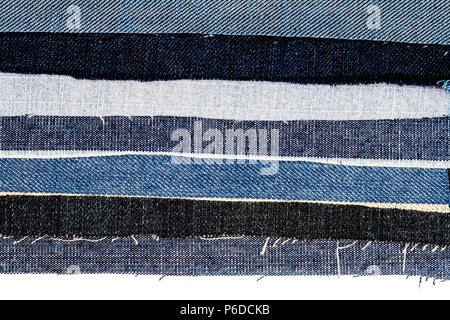 Abstract differenti jeans strappati strisce sullo sfondo di texture. Jeans texture. Jeans rigato sfondo. Jeans Denim texture. Foto Stock