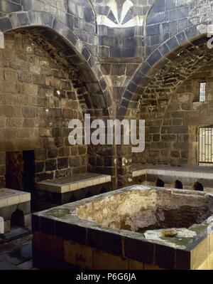 La Siria. Bosra. Hammab Manshak. Vecchi bagni pubblici. Xiv secolo. rovine. All'interno. Foto Stock