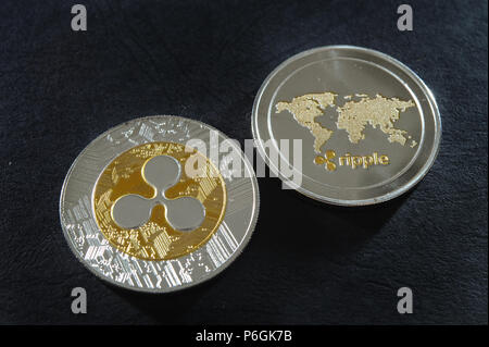 Ripple moneta sulla pelle scura Foto Stock