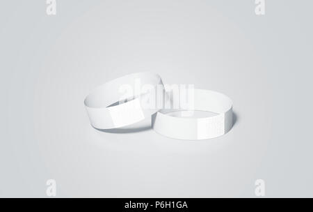 Blank white paper di braccialetti mock up, rendering 3d. Evento vuoto fascette da polso design mockup. Mano a buon mercato bracciali modello, isolata. Cancellare bangle bracciale insieme con adesivo. Concerto bracciale Foto Stock