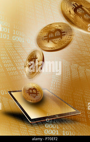 Golden Bitcoins su tavoletta digitale Foto Stock