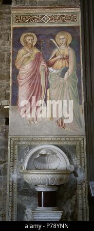 L'Italia. Firenze. Pittura murale con santi e acqua santa font. Xiv-XV secolo. Basilica di San Miniato al Monte. Foto Stock