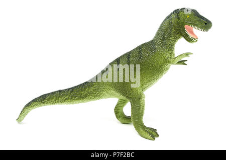 Lato del verde in plastica Tyrannosaurus rex dinosauro giocattolo, isolato su uno sfondo bianco. Foto Stock
