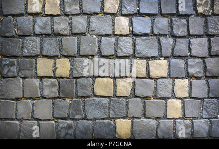 Grigio e giallo pietre per pavimentazione. Gli sfondi e texture. Foto Stock