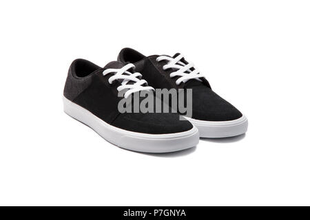 Sneakers nero su sfondo bianco Foto Stock