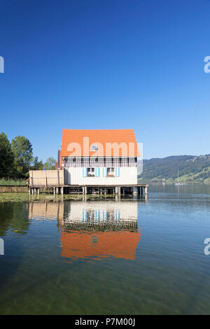 Boathouses sul Alpsee, Immenstadt, Allgaeu, Baviera, Germania Foto Stock