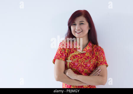 Attraente ragazza cinese vi auguriamo un felice e prospero Anno Nuovo Cinese Gong Xi Fa Cai Foto Stock