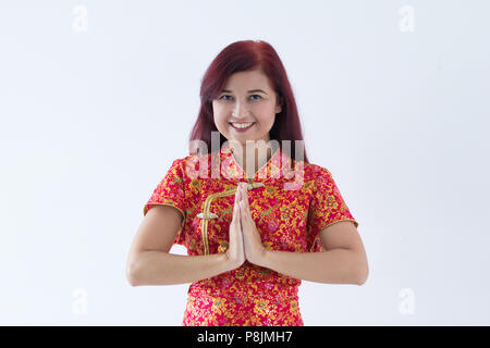 Attraente ragazza cinese vi auguriamo un felice e prospero Anno Nuovo Cinese Gong Xi Fa Cai Foto Stock