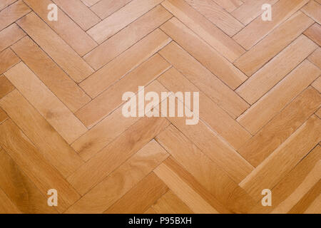 Pavimento in parquet, pavimento in legno closeup - spina di pesce Foto Stock