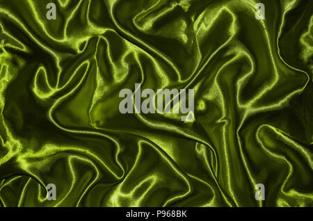 Abstract sfondo verde dal tessuto, carta da parati e texture dal verde di tessili, vista dall'alto e wave della striscia di tessuto. Foto Stock