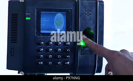 Finger scanner to record working time. Fingerprint scanner with hand, Foto Stock