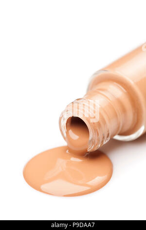 Una bottiglia di vetro e una base liquida che viene prelevato da esso Foto Stock