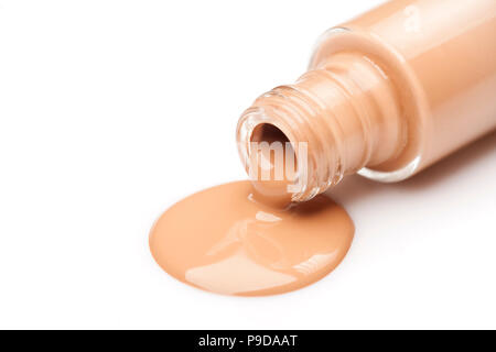 Una bottiglia di vetro e una base liquida che viene prelevato da esso Foto Stock