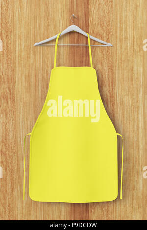 Vuoto grembiule giallo isolato su sfondo di legno con percorso di clipping. 3d'illustrazione. Foto Stock