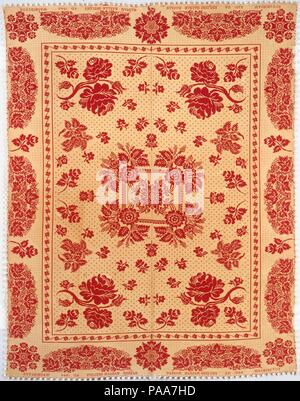 Coverlet. Cultura: American. Dimensioni: escluso fringe: 80 1/4 x 103 a. (203.8 x 261.6 cm.). Data: 1844. Questo rosso di lana e cotone non tinta panno doppio coverlet è tessuto in due pannelli e cuciti al centro. Esso ha una centrale medaglione floreale e quattro grandi rose in campo. Il confine ha grappoli di uva e le foglie che si alternano con Single rose a stelo sui lati sinistro e destro e con tre motivi di fiocco di neve entro i bordi superiore e inferiore. Museo: Metropolitan Museum of Art di New York, Stati Uniti d'America. Foto Stock