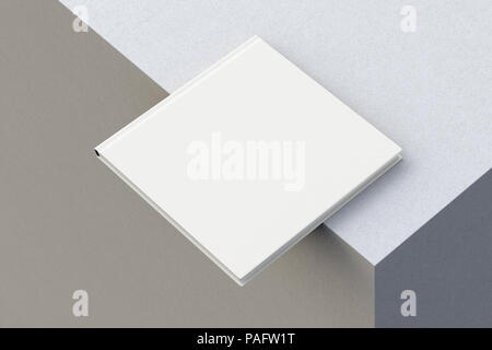 Quadrato bianco libro sul bordo. Isolato con percorso di clipping intorno al libro. 3D render Foto Stock