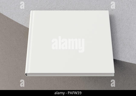 Quadrato bianco libro sul bordo. Isolato con percorso di clipping intorno al libro. 3D render Foto Stock