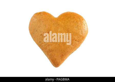 A forma di cuore ad gingerbread cookie isolati su sfondo bianco. Vista dall'alto. Foto Stock