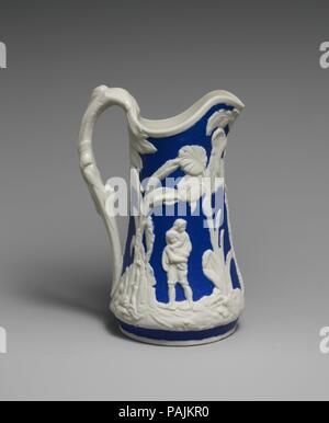 Brocca. Cultura: American. Dimensioni: H. 8 7/8 in. (22,5 cm). Maker: Stati Uniti Pottery Company (1852-1858). Data: 1852-1858. Oggetti in porcellana bianca con figure in bassorilievo su una massa blu richiamare del xviii secolo Wedgwood mercanzia. Questo modello, noto come 'Paolo e Virginia," è una copia di un design inglese. Museo: Metropolitan Museum of Art di New York, Stati Uniti d'America. Foto Stock