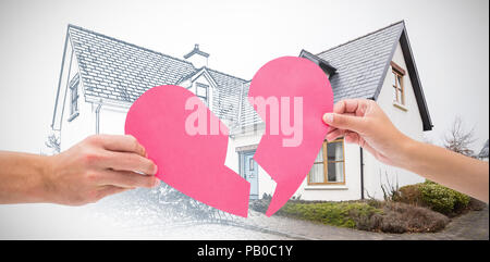 Immagine composita di mani due metà del cuore spezzato Foto Stock