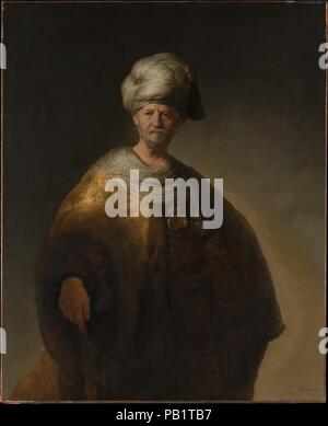 Uomo in costume orientale ("il nobile slavo di'). Artista: Rembrandt (Rembrandt van Rijn) (olandese, Leiden 1606-1669 Amsterdam). Dimensioni: 60 1/8 x 43 3/4a. (152,7 111.1x cm). Data: 1632. Confrontato con Rembrandt la formale ritratti dello stesso anno, questa immagine è notevole per la sua brillante pennellata e illuminazione drammatica. È stato probabilmente dipinto poco dopo si trasferì dalla sua nativa Leiden ad Amsterdam e nei suoi soggetti esotici e lo stile è sicuramente destinato ad un esperto collezionista. Foto di immaginario in persiano e ottomano, o altrimenti 'orientale' capi erano popolare al momento becaus Foto Stock