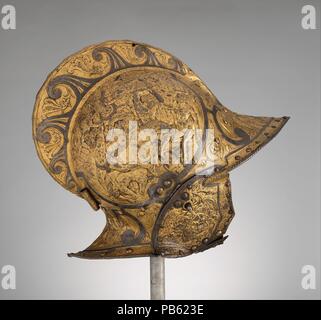 Burgonet. Cultura: francese. Dimensioni: H. 14 a. (35,6 cm); W. 8 1/4 in. (21 cm); D. 14 1/4 in. (36,2 cm); peso senza buffe 4 lb. 3 oz. (1905 g). Data: ca. 1550. I medaglioni su entrambi i lati della vaschetta sono goffrati con scene di mitologia greca che raffigura la Battaglia dei Centauri e Lapiti, argomento popolare in arte rinascimentale. Le composizioni derivano in parte dalla progettazione del Rosso Fiorentino (1494-1540), uno degli artisti italiani chiamati a Fontainebleau per lavorare per la corte francese. Probabilmente realizzato per Enrico II di Francia (regnò 1547-59), il casco passati come dono diplomatico di MED Foto Stock