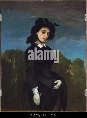 La donna in un abito di equitazione (L'Amazone). Artista: Gustave Courbet (francese, Ornans 1819-1877 La Tour-de-Peilz). Dimensioni: 45 1/2 x 35 1/8 in. (115,6 x 89,2 cm). Data: 1856. Questo dipinto di un horsewoman (in francese, <i>amazone</i>) è stato a lungo pensato per rappresentare il poeta e romanziere Louise Colet, musa di scrittore Gustave Flaubert. Tuttavia il sitter è stata identificata come Madame Clément Laurier. Questo lavoro, realizzato in occasione del suo matrimonio nel 1856, forma una coppia con Courbet il ritratto del marito (1855, Milwaukee Art Museum). L'artista Mary Cassatt ammirato questa immagine come "i migliori w Foto Stock