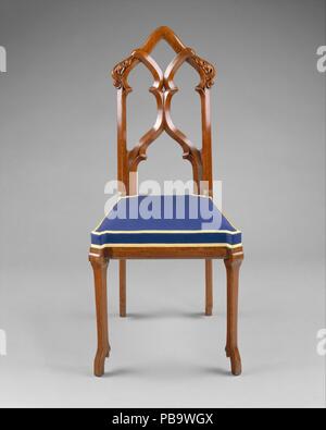 Sedia laterale. Cultura: American. Progettista: ideato da Alexander Jackson Davis (American, New York 1803-1892 di West Orange, New Jersey). Dimensioni: 39 5/8 x 18 1/2 x 18 in. (100,6 x 47 x 45,7 cm). Autore: eventualmente da ustioni e fratello. Data: ca. 1857. Questo delicato ma animato sedia laterale è un esempio magistrale del revival gotico di stile. Ha un bellissimo retro composta di aprire tracery e gambe sottili che la primavera dai piedi che assomigliano a diminutivo del cervo zoccoli. Davis, uno degli architetti preminente del XIX secolo in America e ha lavorato in altri stili di ripresa come pure gotico. A volte Foto Stock