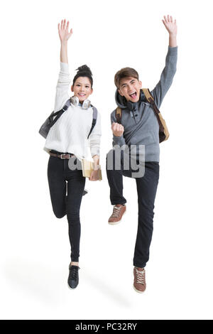 Allegro studenti del college jumping Foto Stock