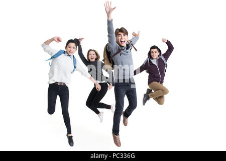 Allegro all'estero studenti jumping Foto Stock